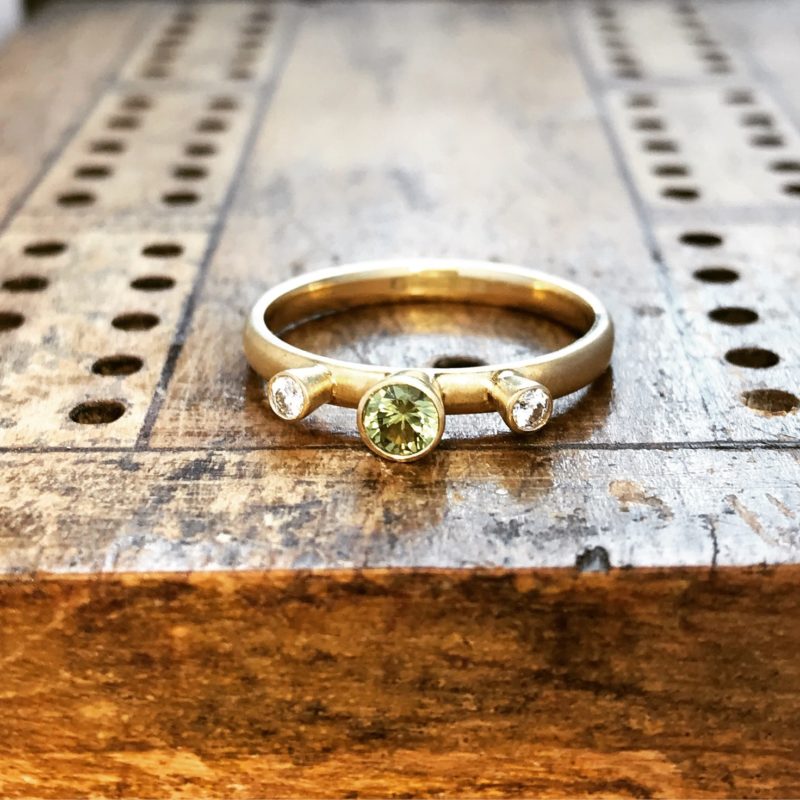 Peridot and diamond ring